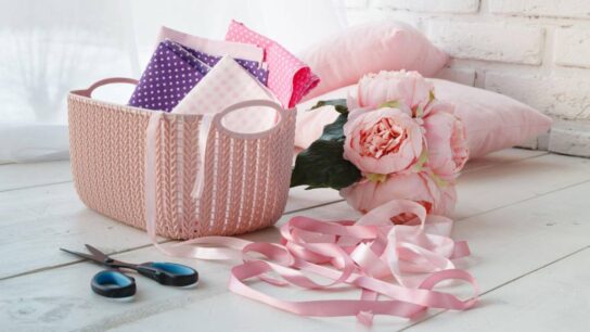 Leisure concept, home organizers colored baskets with handmade accessories