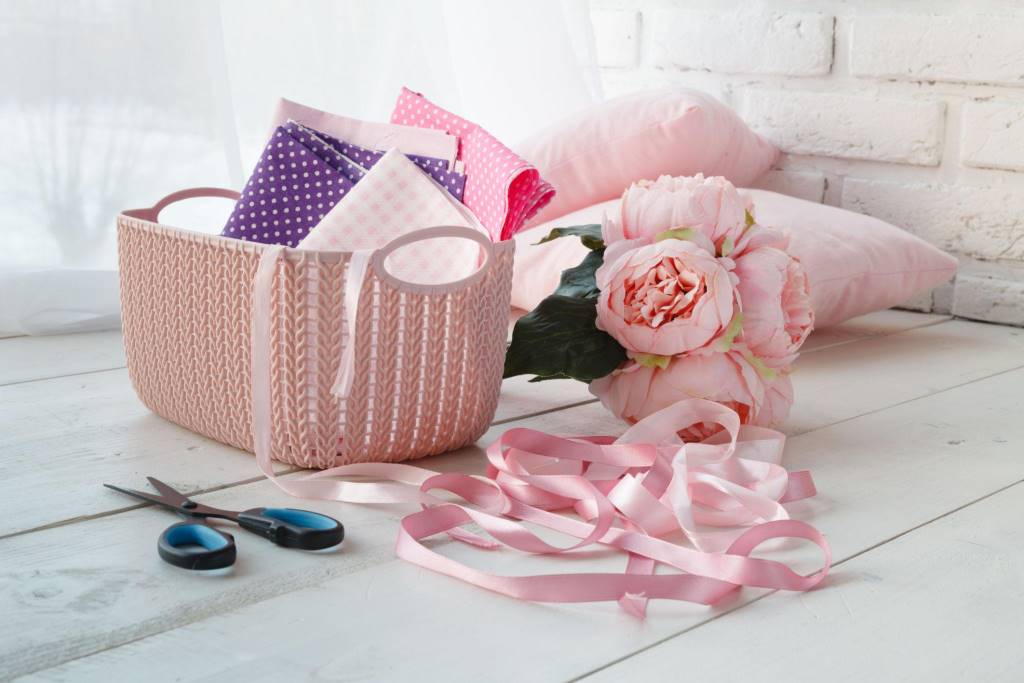 Leisure concept, home organizers colored baskets with handmade accessories