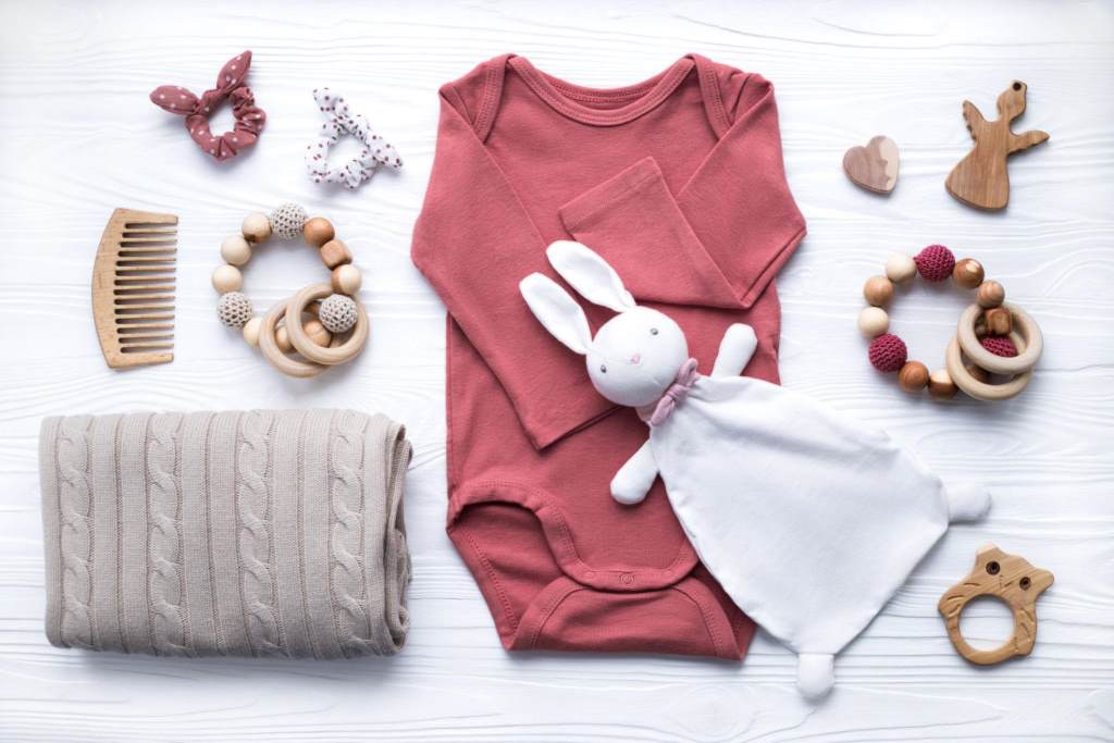 Self care setup for pregnant woman with candles and skincare